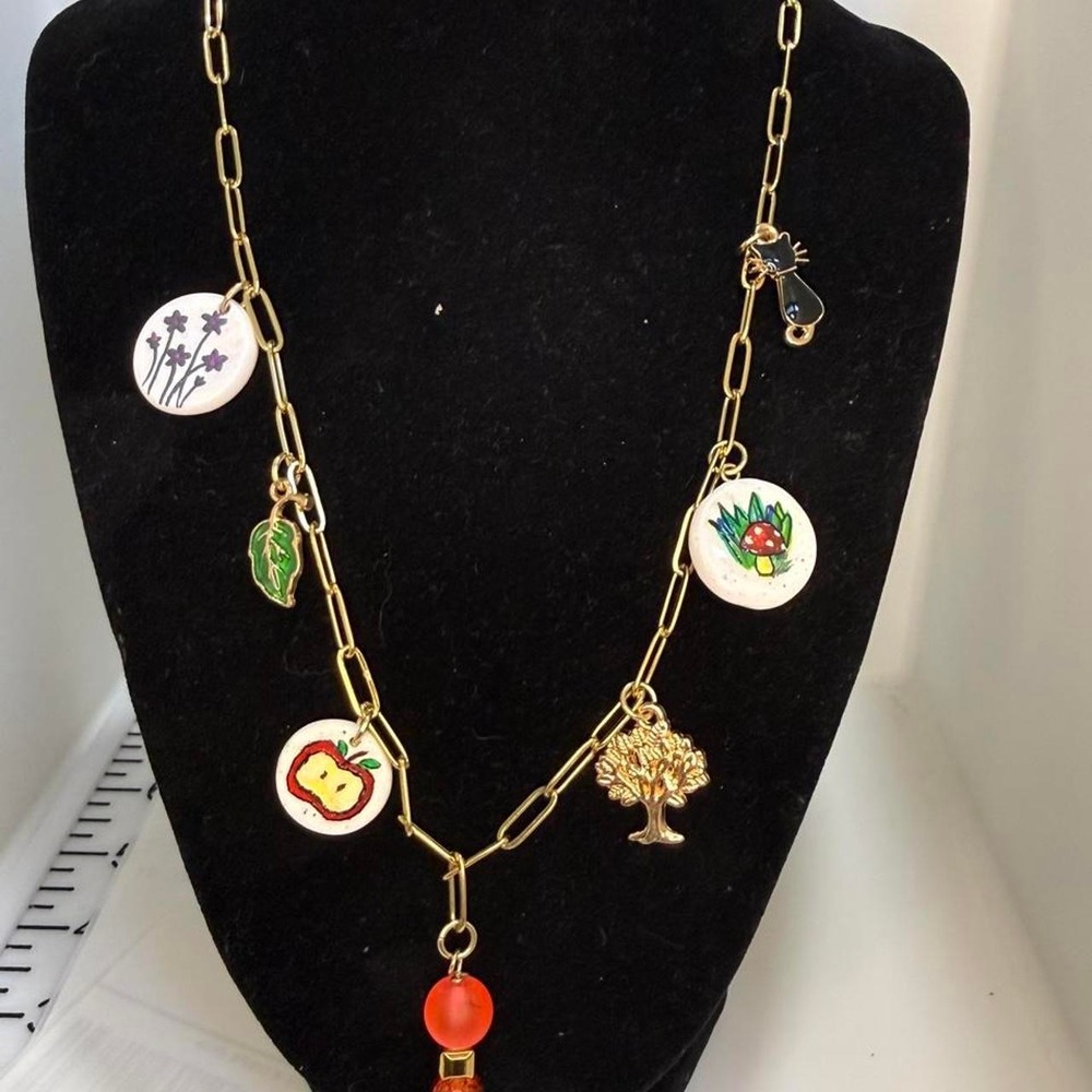 Handmade whimsical necklace with gold chain and various charms